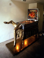 Edward & Nancy Reddin Kienholz / 
The Bronze Pinball Machine with Woman Affixed Also, 1980 / 
mixed media assemblage / 
70 1/2 x 126 x 32 in (179.1 x 320 x 81.3 cm) / 
Private Collection
