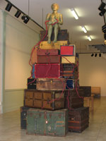 Alison Saar / 
Vestige, 2012 / 
fiberglass, wool, audio, found trunks and suitcases / 
72 x 72 x 156 in. (182.9 x 182.9 x 396.2 cm)