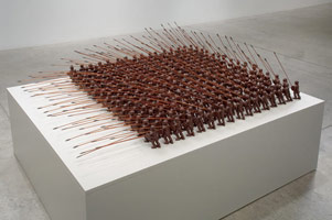 Syntagma, 2008 - 2009 / 
porcelain, mahogany, bismuth alloy / 
overall: 72 x 60 x 16 in (182.9 x 152.4 x 40.6 cm) / 
each: 6 in. (15.2 cm); total 256 soldiers / 
Private collection