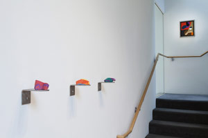 From left to right: / 
 / 
Richard Deacon / 
Some More For The Road #12, 2007 / 
pigmented acrylic reinforced plaster, stainless steel wall bracket / 
1 3/4 x 3 3/8 x 1 3/4 in. (4.4 x 8.6 x 4.6 cm) / 
 / 
Some More For The Road #2, 2007 / 
pigmented acrylic reinforced plaster, stainless steel wall bracket / 
2 x 3 1/4 x 1 5/8 in. (5.1 x 8.1 x 4.2 cm) / 
 / 
Some More For The Road #8, 2007 / 
pigmented acrylic reinforced plaster, stainless steel wall bracket / 
1 1/2 x 4 1/4 x 1 3/4 in. (4 x 10.8 x 4.5 cm)
 /  / 
Frederick Hammersley / 
Second shift, 1985 / 
oil on wood / 
framed: 14 5/8 x 12 5/8