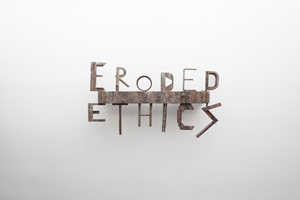 Michael C. McMillen / 
Eroded Ethics, 1990 / 
painted wood and metal with light / 
28 3/4 x 50 3/4 x 5 3/4 in (73 x 128.9 x 14.6 cm)