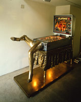 Edward & Nancy Reddin Kienholz / 
The Bronze Pinball Machine with Woman Affixed Also, 1980 / 
mixed media assemblage / 
74 x 41 x 82 in. (188 x 104.1 x 208.3 cm) / 
Private collection