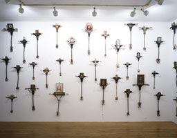 Edward & Nancy Reddin Kienholz / 
76 J.C.s Led the Big Charade, 1993-1994 / 
mixed media: 76 wall-mounted pieces dimensions variable