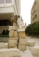 Gwynn Murrill / 
Life-size cast bronze sculpture of a native San Gabriel Mountain bighorn sheep poised atop two columns of rough-hewn limestone blocks / 
Height: 127 in. (323 cm)
Diameter: 144 in. (366 cm