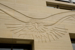  Gwynn Murrill / 
Intaglio carving of eagle set into limestone panels / 
Approximately 114 x 504 in. (290 x 1280 cm)