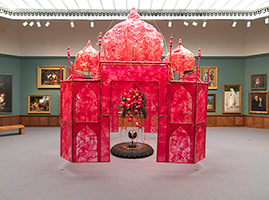 Rina Banerjee / 
Take me, take me, take me . . . to the Palace of love, 2003 / 
plastic, antique Anglo-Indian Bombay dark wood chair, steel and copper framework, floral picks, foam balls, cowrie shells, quilting pins, red-colored moss, antique stone globe, glass, synthetic fabric, shells, fake birds / 
226 x 161 x 161 in. (574 x 409 x 409 cm)