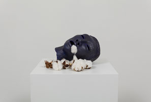 Alison Saar / 
Cotton Eater (head), 2013 / 
ceramic, acrylic, graphite, and cotton balls  / 
7 1/2 x 16 x 9 in. (19.1 x 40.6 x 22.9 cm)