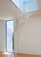 Fran Siegel / 
Fugitive, 2009 / 
porcelain; wire; paper mache; monofilament; reflective mylar; tinted films / 
approx. 90 x 130 in. (228.6 x 330.2 cm)