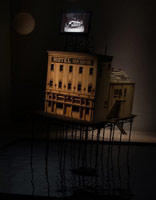 Michael C. McMillen / 
Lighthouse (Hotel New Empire), 2010 / 
      mixed media with artist digital motion picture / 
      97 x 132 x 144 in. (246.4 x 335.3 x 365.8 cm)