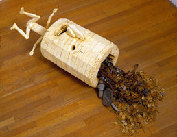 Cylinder Head, 1990 / 
carved and painted wood with metal debris / 
20 x 34 1/2 x 16 in (50.8 x 87.6 x 40.6 cm)