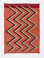Unknown (Navajo) / 
Navajo Classic Serape, circa 1870 / 
White is undyed native handspun; dark
red is 3 ply yarn (Saxony) dyed with
Cochineal; light red is
raveled American flannel dyed with
Aniline; blue is native handspun dyed
with Indigo / 
71 x 50 1/2 in. (180.3 x 128.3 cm)