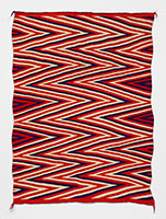Unknown (Navajo) / 
Navajo Wedge-weave Eye-dazzler, circa
1880 / 
Handspun native wool: white is un-dyed
native handspun wool; the blue is native
handspun dyed with indigo; and the red is
aniline dyed native handspun wool / 
78 3/4 x 59 3/4 in. (200 x 152 cm)