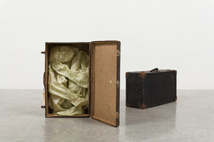 Alison Saar / 
Pret-a-Porter, 2013 / 
paper, matte medium, wax, pigment, and found suitcases / 
Suitcase 1 of 2: 26 x 15 x 8 in. (66 x 38.1 x 20.3 cm) / 
Suitcase 2 of 2: 28 x 14 x 9 in. (71.1 x 35.6 x 22.9 cm)