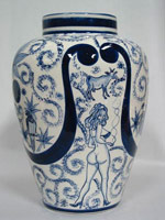 Eduardo Sarabia / 
A thin line between love and hate 37, 2005 / 
hand painted ceramic vase and silkscreen box / 
Object: Height: 12 1/2 & Diameter: 8 1/2 in.
(31.8 x 21.6 cm) / 
Box: 14 x 13 1/2 x 17 1/2 in. (35.6 x 34.3 x 44.5 cm) / 
Private collection 