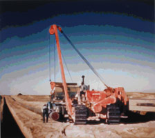 Timothy Tompkins / 
Translation - Laying Oil Pipe Near Kirku, 2007 / 
commercial sign enamel on aluminum  / 
60 x 67 in. (152.4 x 170.2 cm) / 
Private collection 