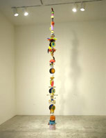 Don Suggs / 
American Feast Pole #2 (Cocky), 2002 / 
        plastic objects and oil paint / 
        158 x 18 x 18 in. (401.3 x 45.7 x 45.7 cm) 