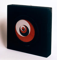 Marcel Duchamp / 
Rotoreliefs (Optical Disks), 1965 / 
Set of six cardboard disks, supplied with a suspension unit, a wooden box covered with black velvet, supporting a motor on the back which drives a revolving turntable / 
Disks printed on both sides in color offset lithography / 
To be viewed as they rotate at 33 1/3 revolutions per minute / 
Each Disk Dimensions: 7 7/8 in. (20 cm.) diameter / 
Box Dimensions: 14 3/4 x 14 3/4 x 3 5/16 in. (37.5 x 27.5 x 8.5 cm.)