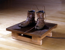 Peter Shelton / 
boots, 1989 / 
bronze, water, copper and pump  / 
15 x 22 x 22 in (38.1 x 55.9 x 55.9 cm) 