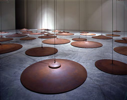 Peter Shelton / 
sixtyslippers, 1997 / 
cast iron / 
60 discs of variable dimensions