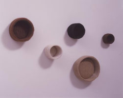 Edgard de Souza / 
Tigelinha (Grupo I) (Group of Small Bowls), 2004 / 
cow hide / 
24 x 35 x 4 in (60 x 90 x 10 cm)
